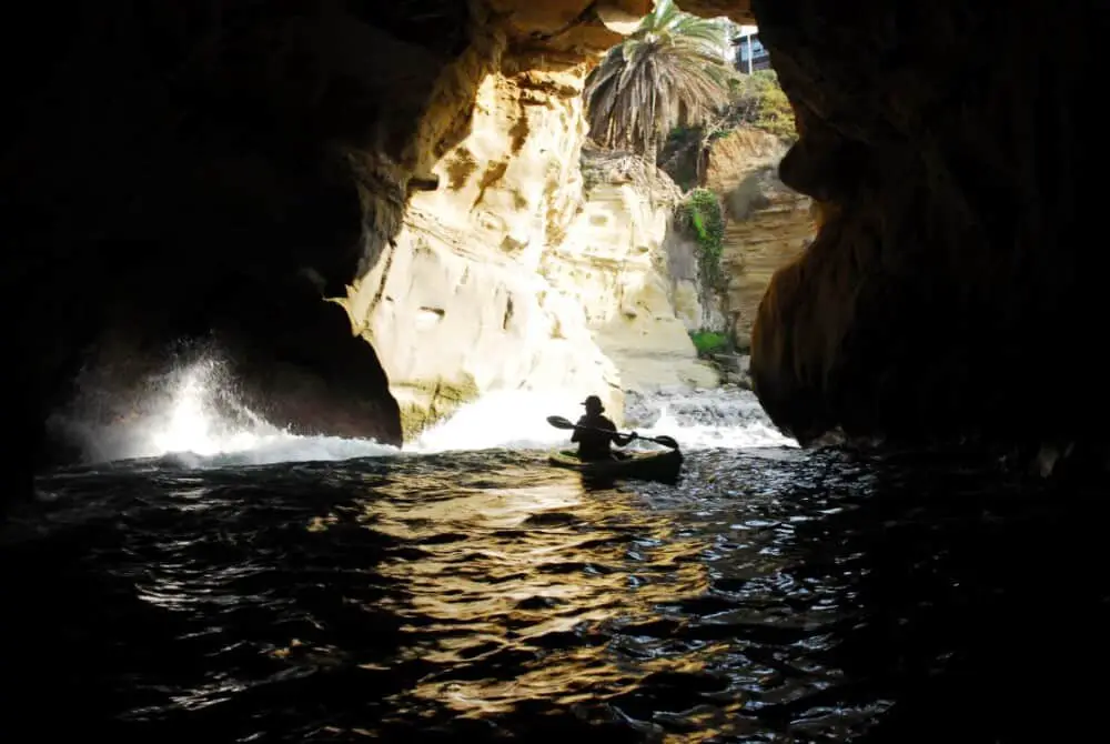 Sea cave in La Jolla with kayak-er. 