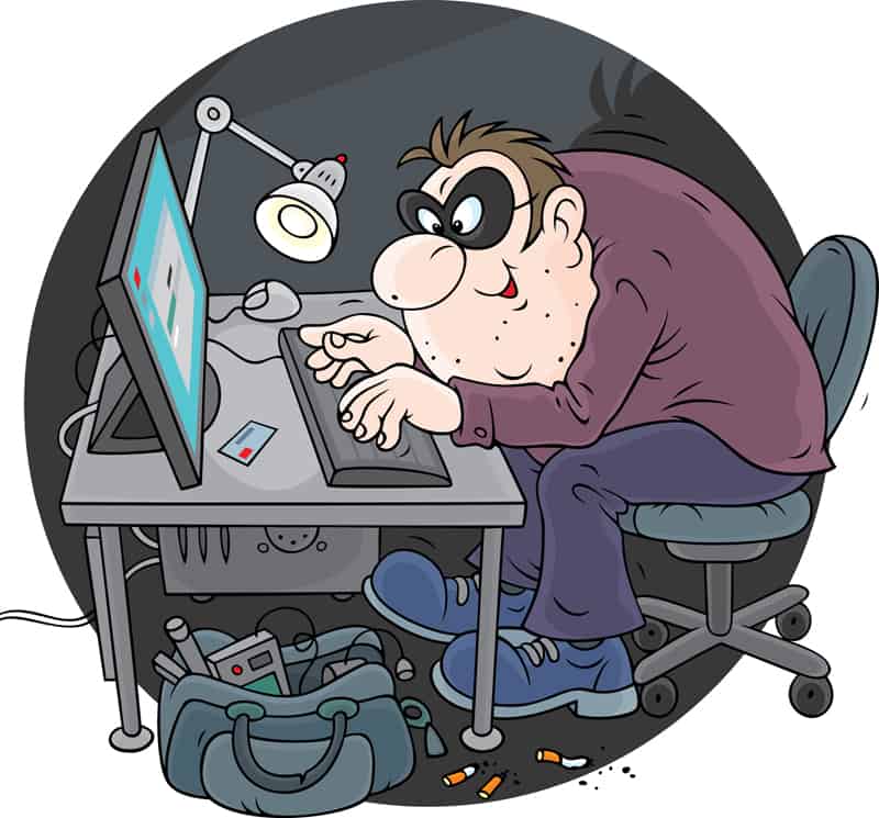cartoon drawing of a masked online criminal at his computer.