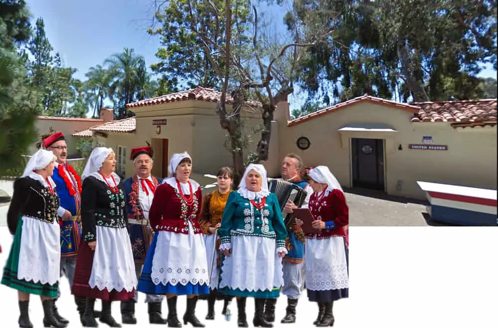 House of Pacific Relations International Cottages. United States and Poland cottages with Polish singers in folk costumes.