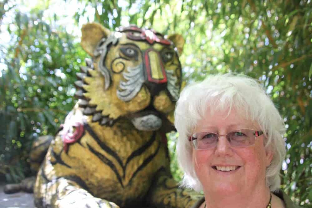 The Sumatran style tiger sculpture in the San Diego Safari Park Tiger Trail exhibit...and me, Nancy Ulrich.