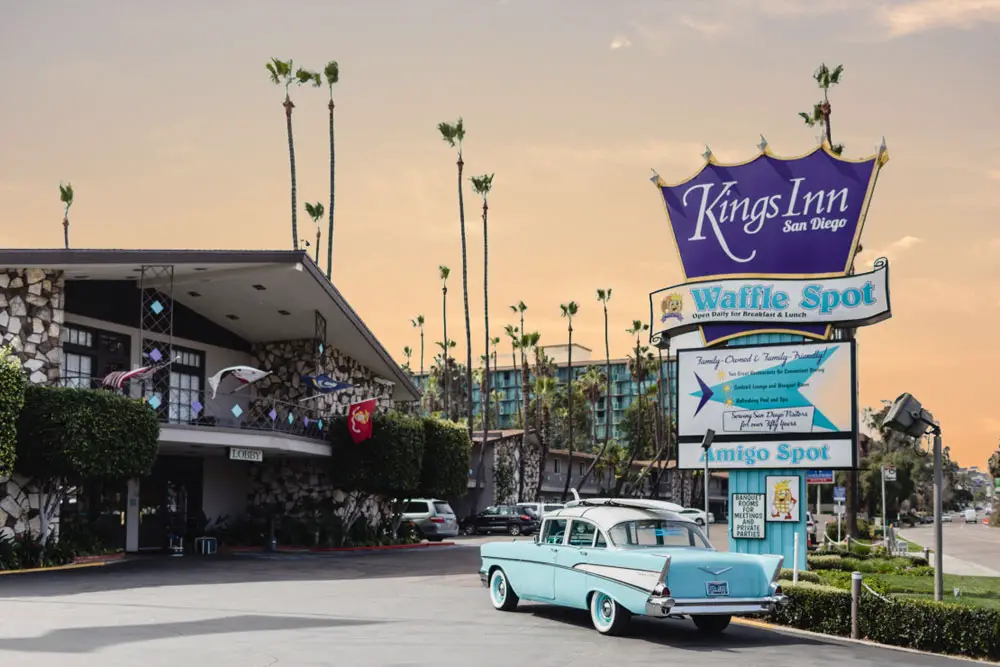 Kings Inn San Diego front entrance with 1950s car and surfboard