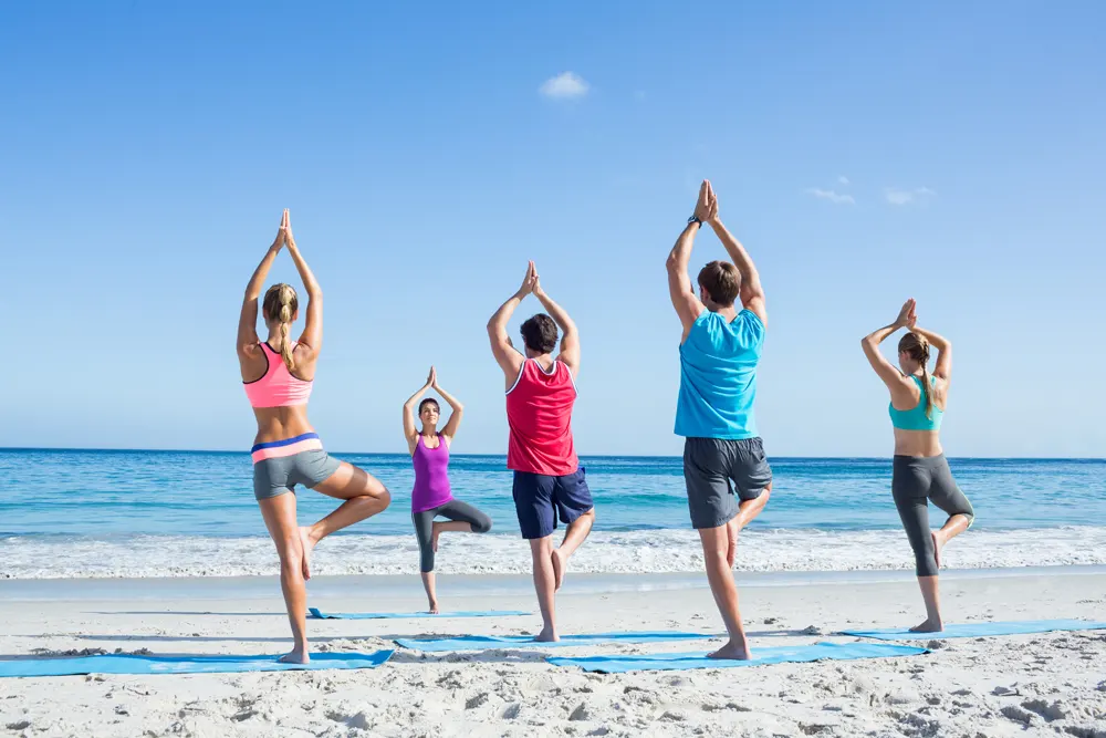 Yoga class on the beach