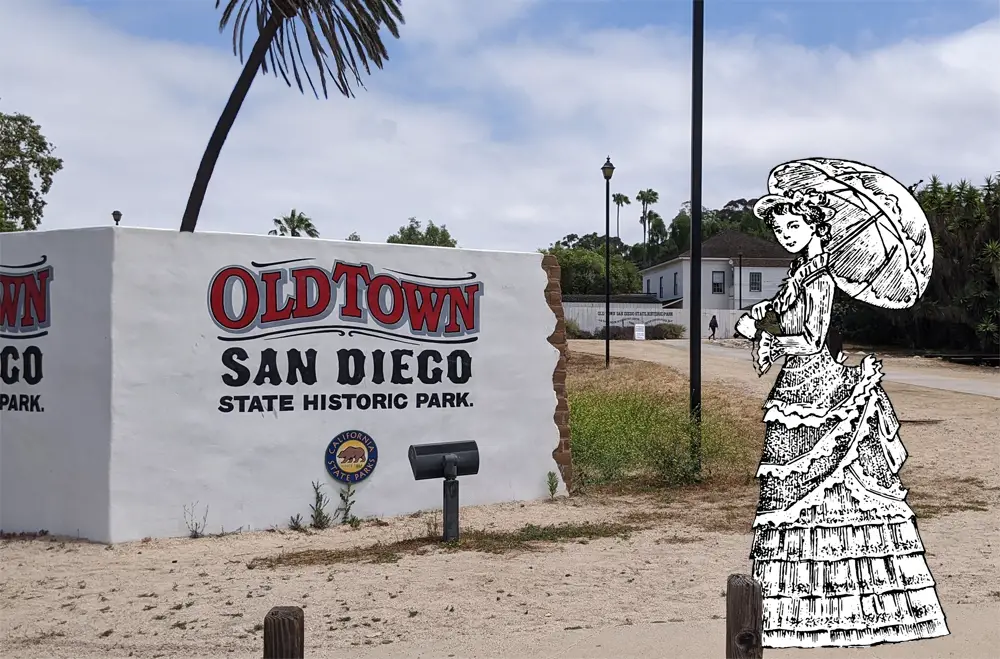 Old Town San Diego State Historic Park sign with Victorian lady with parasol drawing on right side. 